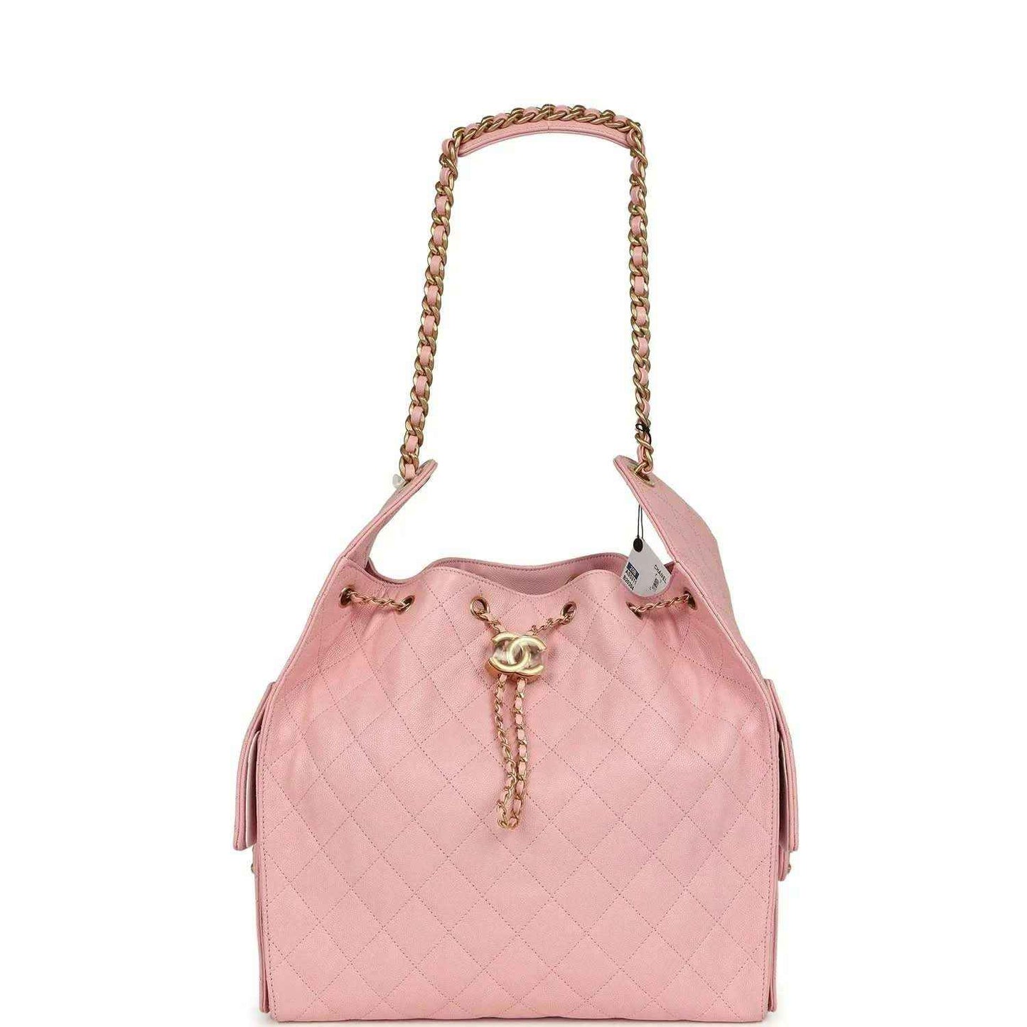 Light pink quilted caviar leather hobo bag with gold chain handles and tassel charm