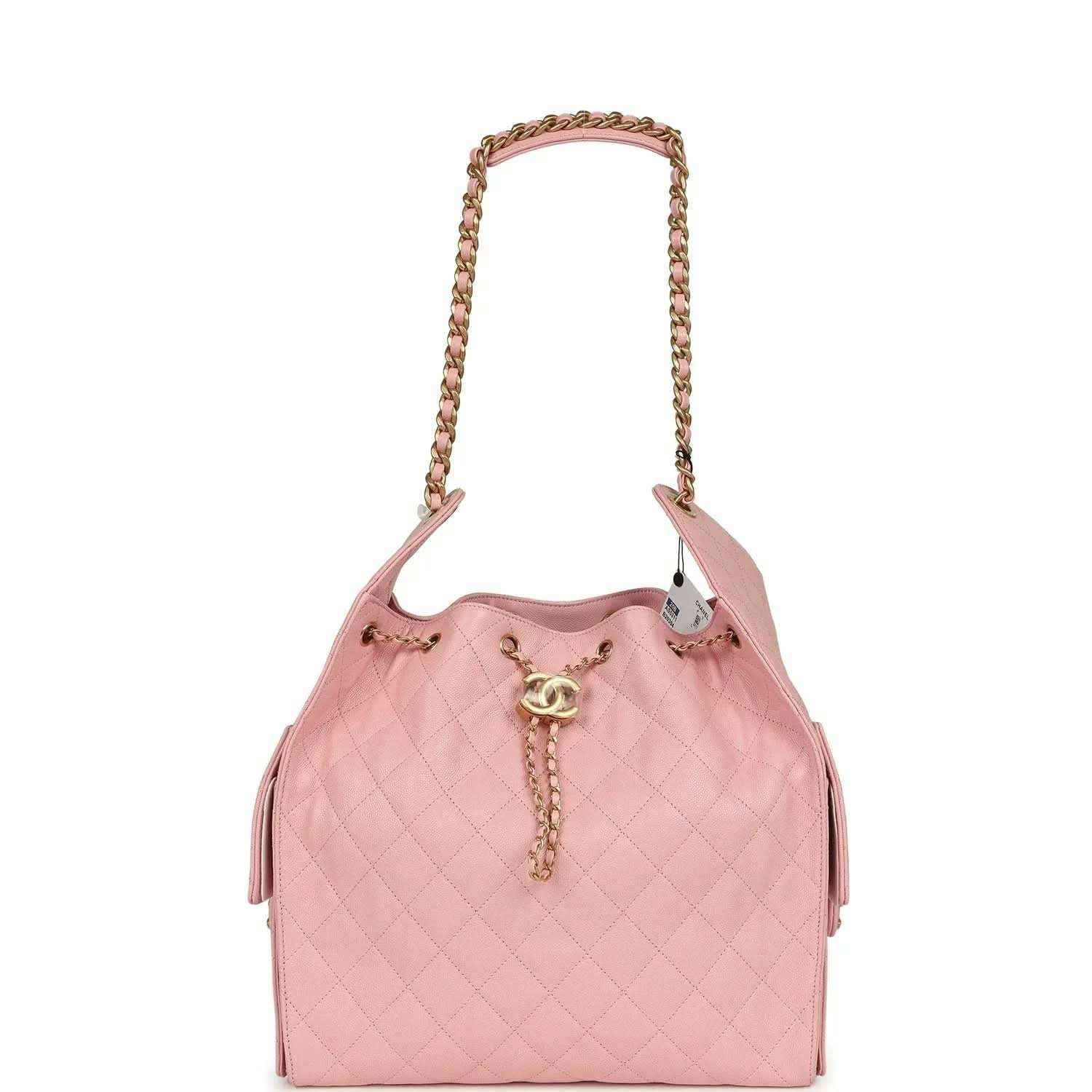 Light pink quilted caviar leather hobo bag with gold chain handles and tassel charm