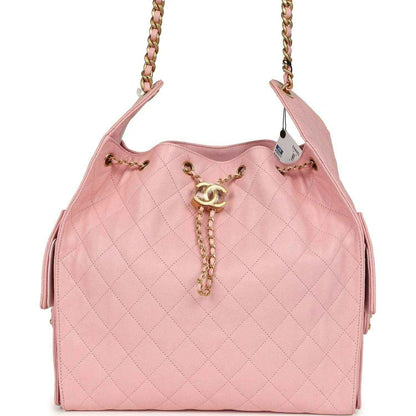 Light pink quilted caviar leather hobo bag with gold chain strap and CC charm