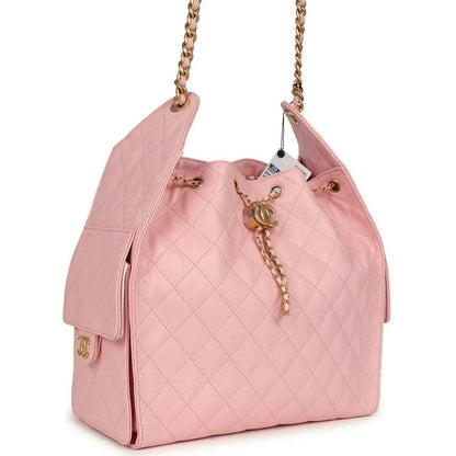 Light pink quilted caviar leather hobo bag with gold chain strap and side pocket
