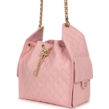Light pink quilted caviar leather hobo bag with gold chain strap and front CC charm