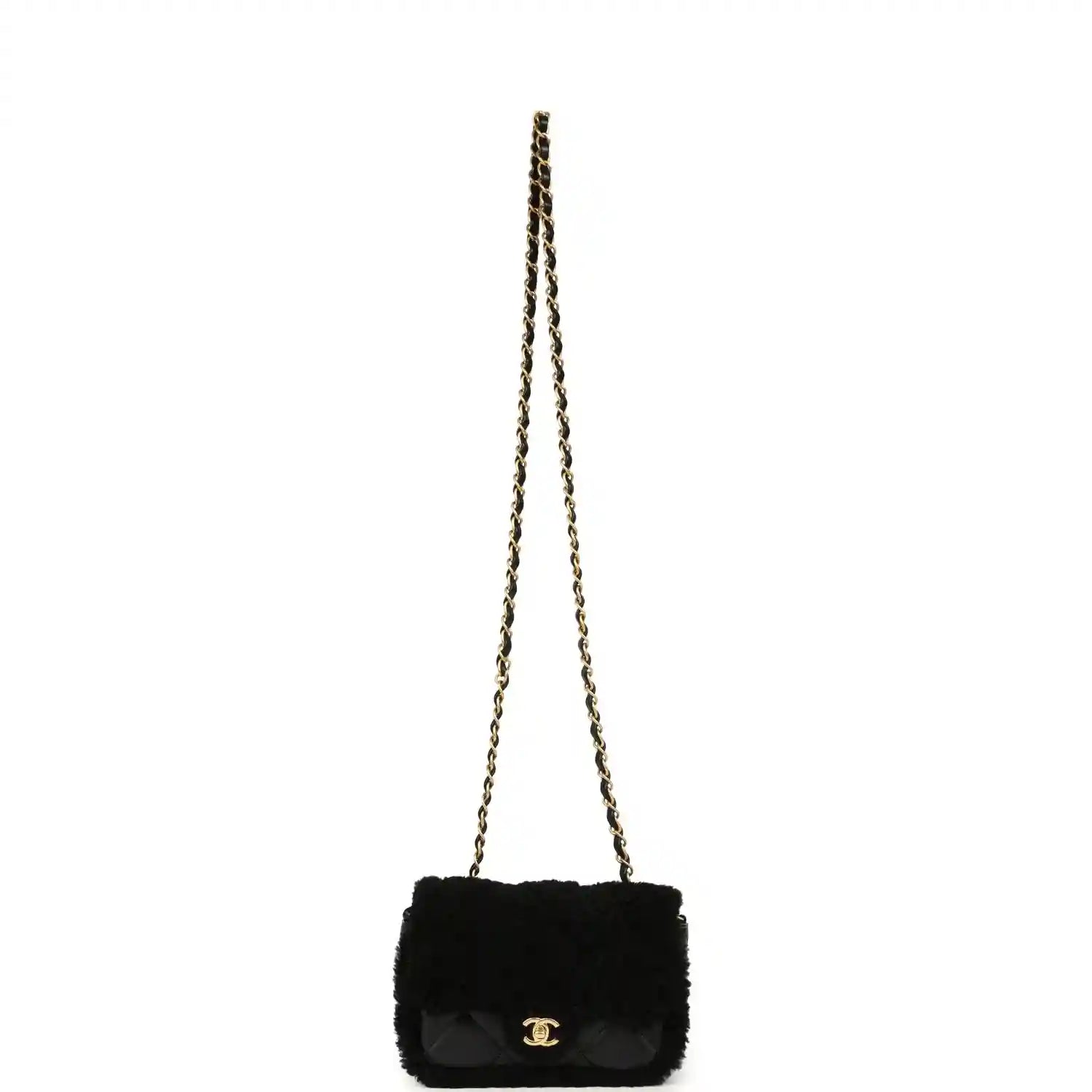 Black mini flap bag with shearling and gold chain strap, quilted flap and CC clasp