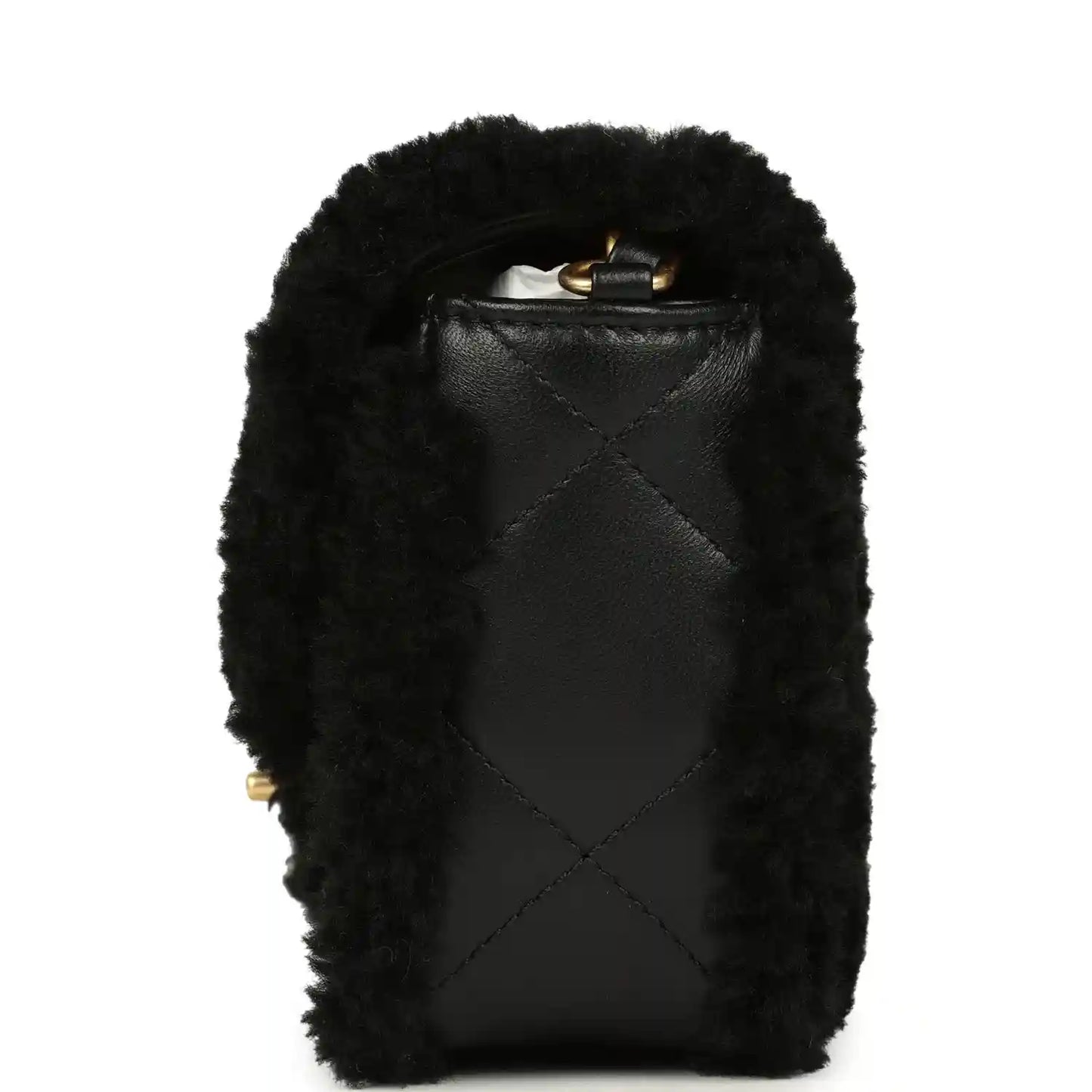 Black mini flap bag with shearling and leather back panel, small gold hardware