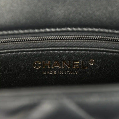 Black lambskin bag interior panel with gold CHANEL logo and zipper trim