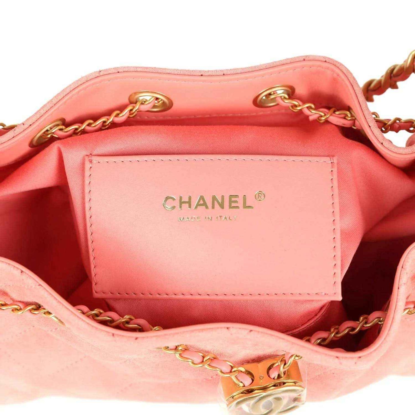 Chanel mini hobo bag lining with CHANEL logo tag, pink suede exterior, gold-tone rings