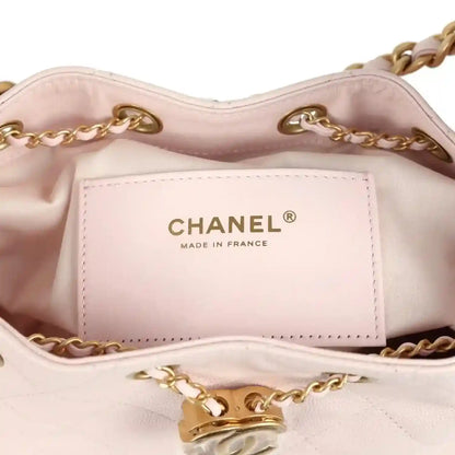 Pink mini hobo bag interior with Chanel label and antique gold chain hardware