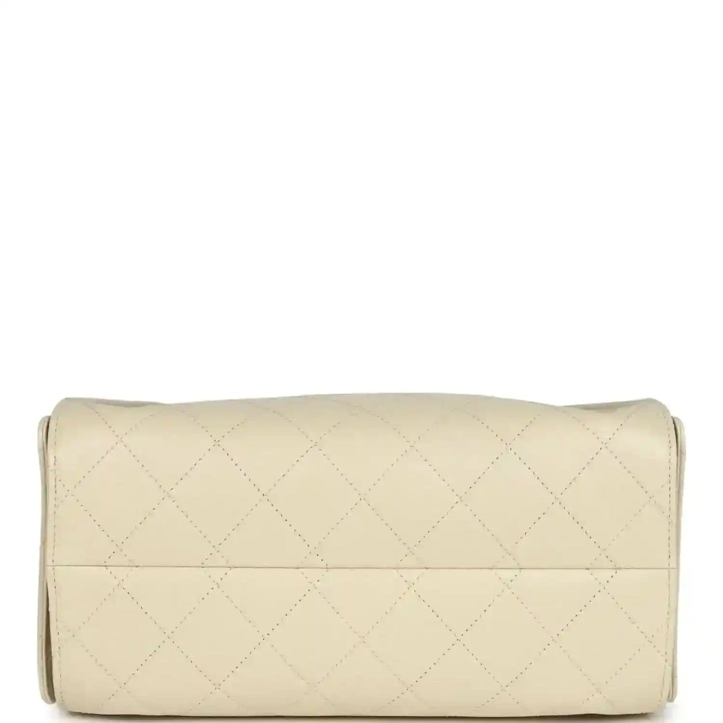 Light beige quilted hobo bag with cylindrical base and stitched seam across front