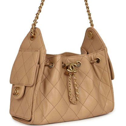 Beige mini hobo bag with quilted caviar texture, front Chanel clasp, chain strap