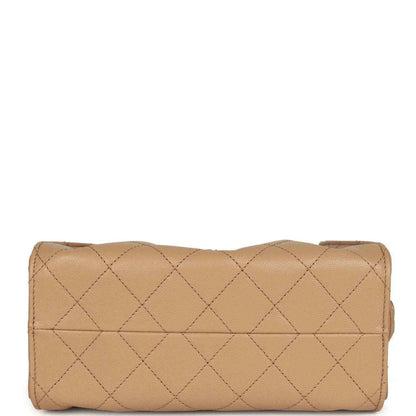 Beige diamond-quilted caviar leather mini hobo bag with rolled top