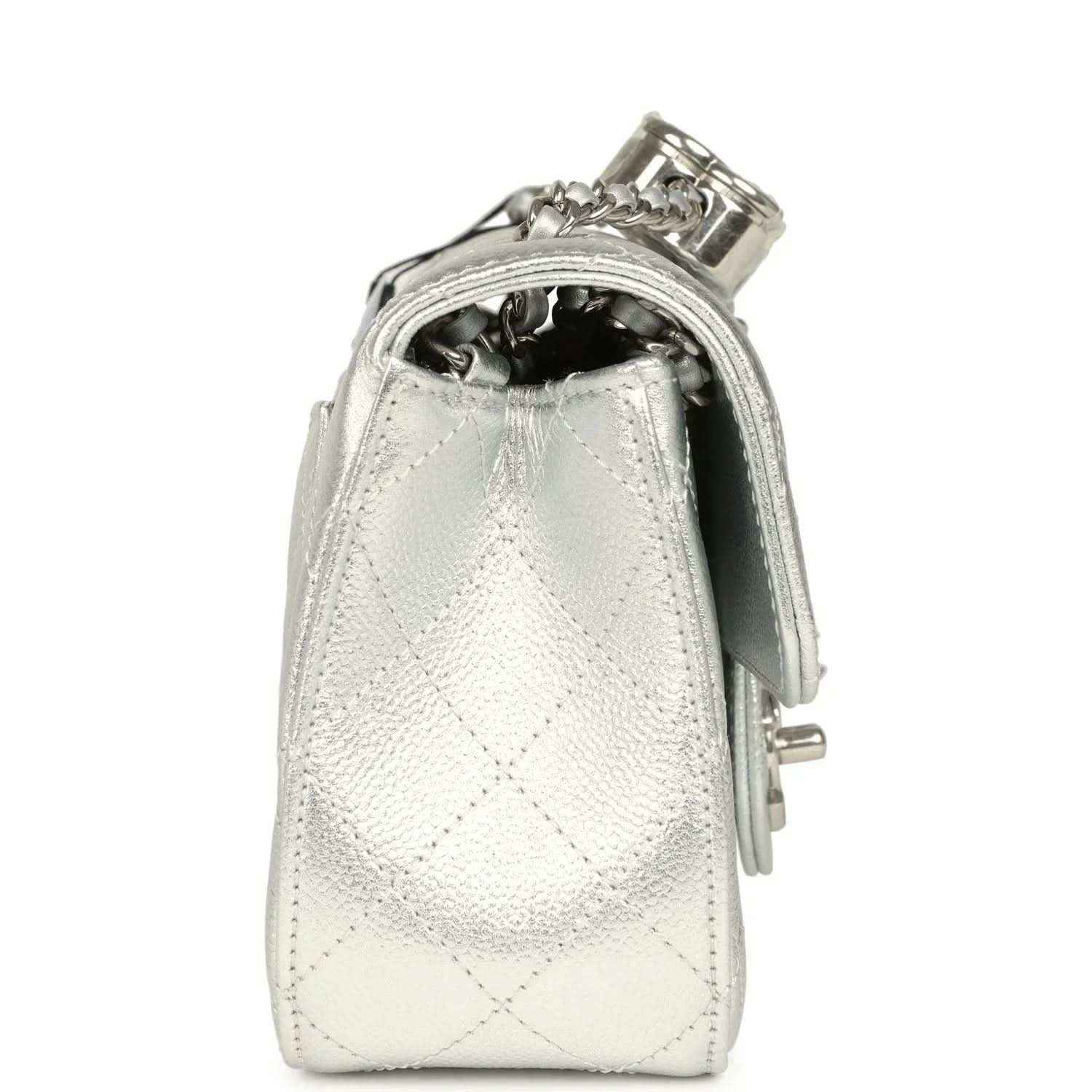 Chanel mini CC flap bag side view in silver metallic with chain strap and top latch