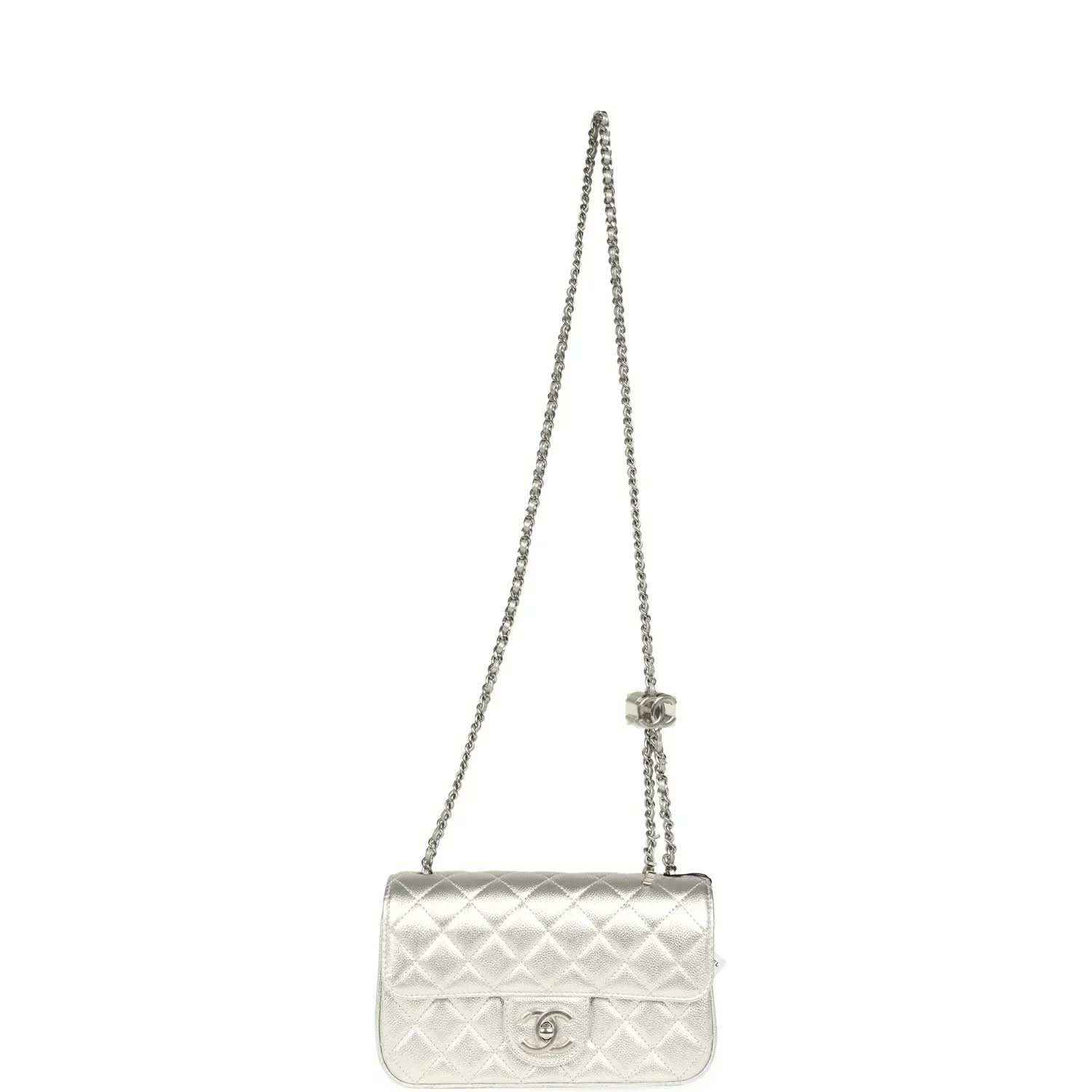 Chanel mini CC flap bag on a silver chain strap in quilted metallic leather