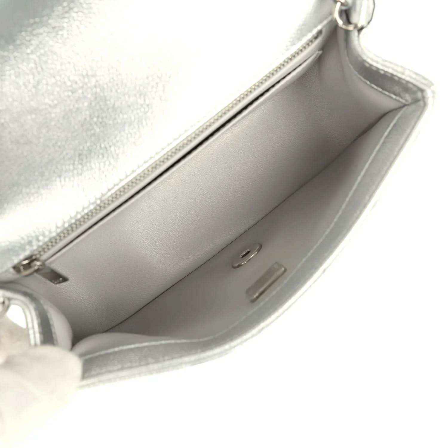 Chanel mini CC flap bag interior view in silver leather with open top