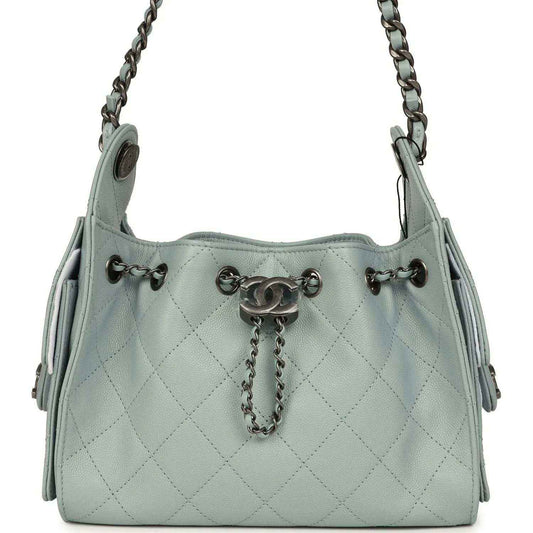 Light blue quilted mini hobo bag with chain shoulder strap and turn-lock hardware