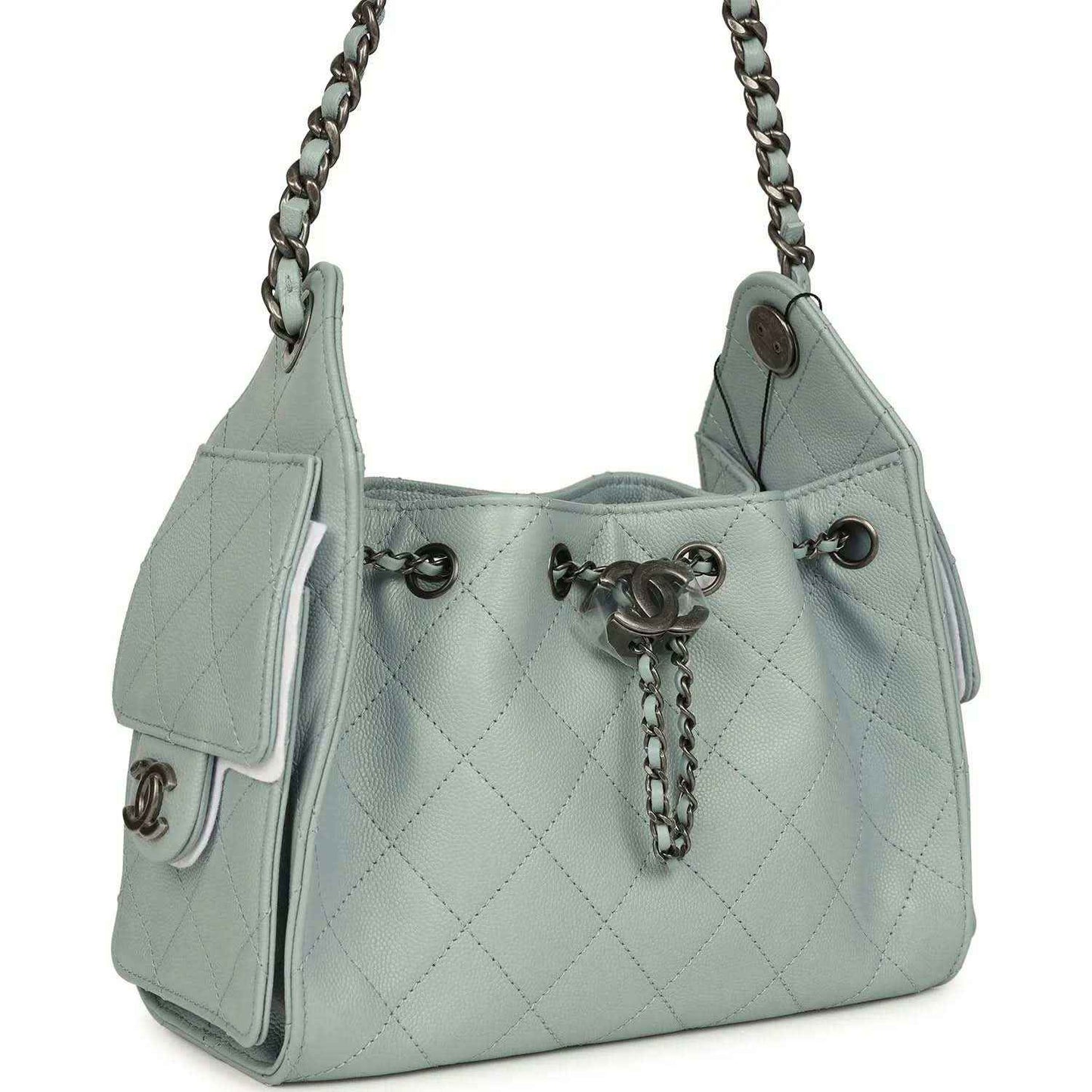 Light blue quilted mini hobo bag with chain strap, front snap pocket, and turn-lock