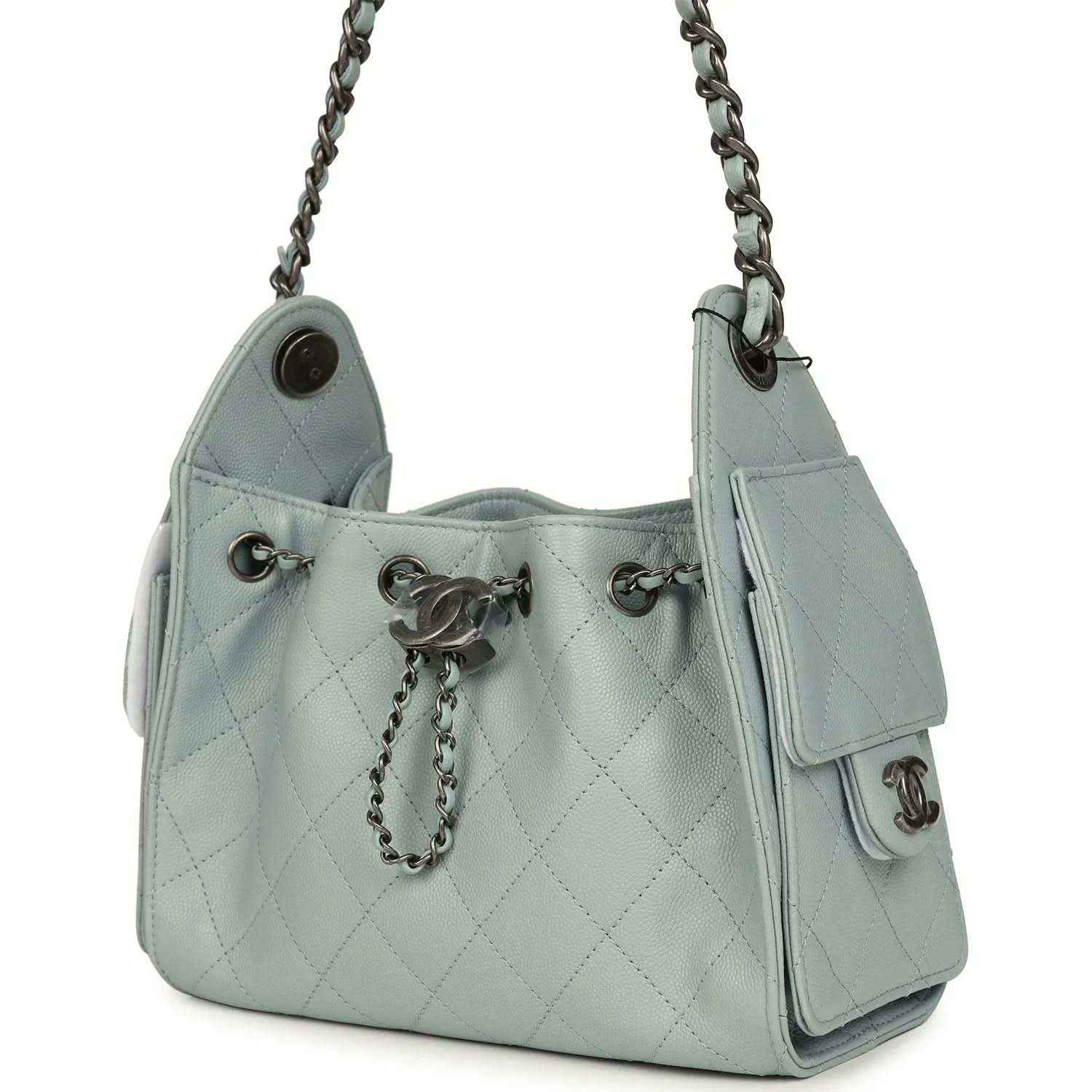 Light blue quilted mini hobo bag with chain tassel pull, side tabs, and turn-lock