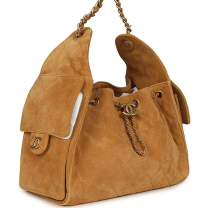 Tan suede hobo bag with open sides, antique gold chain and CC turn-lock hardware
