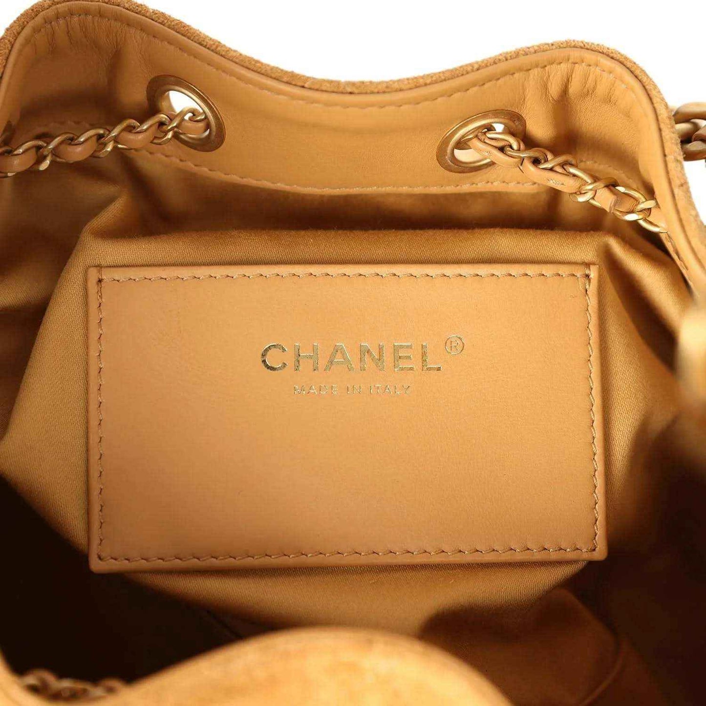 Tan leather inner pocket with CHANEL logo and gold chain detail