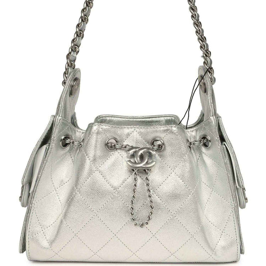 Metallic silver mini hobo bag with quilted caviar texture, chain strap, logo clasp