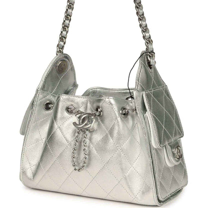 Metallic silver mini hobo bag with quilted caviar texture, chain strap, side ring hardware