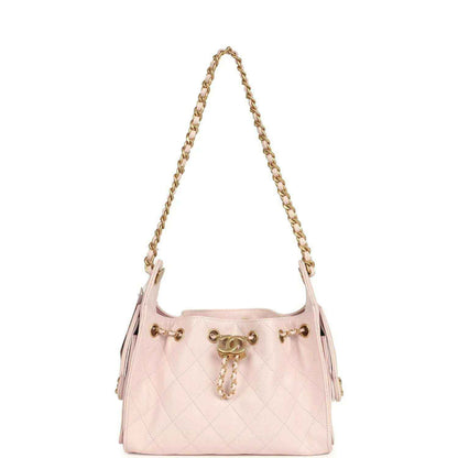 Pink mini hobo bag with gold chain handle, quilted body and side tassel