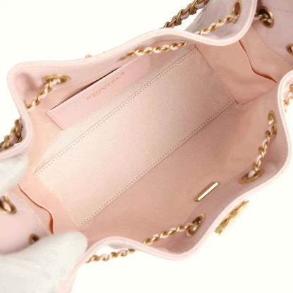 Pink mini hobo bag interior with stitched panel and gold hardware details