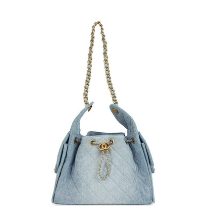 Chanel small hobo bag in light blue denim with gold chain handles and CC clasp