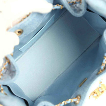 Chanel small hobo bag interior lining in light blue leather with gold chain strap visible