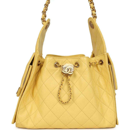 Yellow quilted caviar hobo bag with chain handles, CC charm, gold hardware