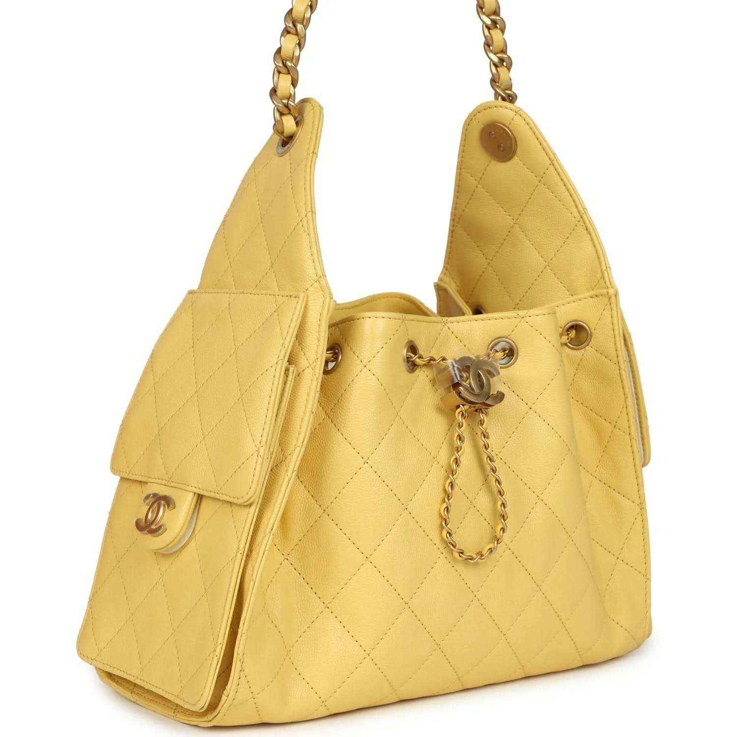 Yellow quilted caviar hobo bag with flap pocket, chain handles, CC charm