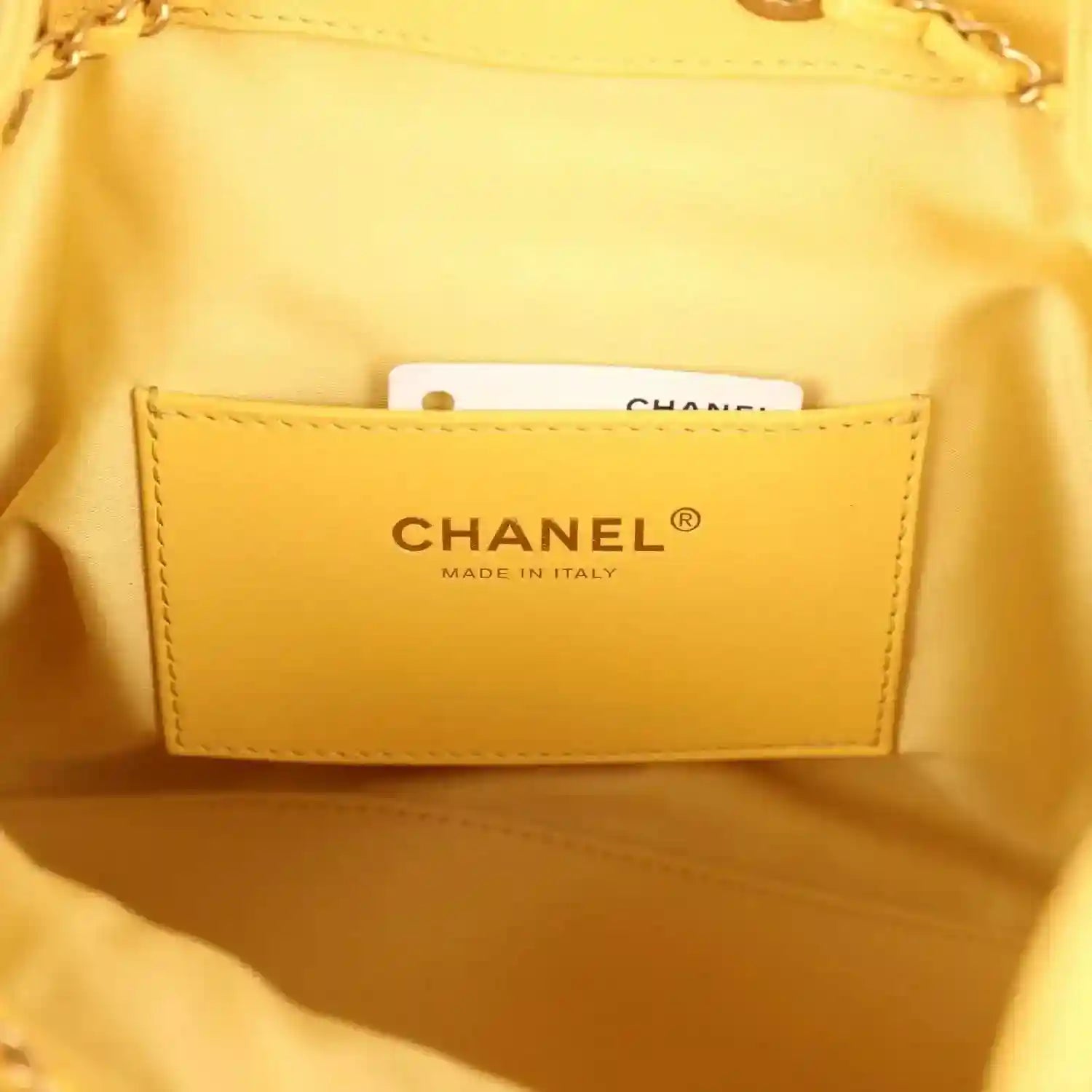 Chanel made in Italy label inside yellow quilted hobo bag, fabric pocket