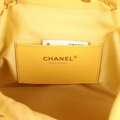 Chanel made in Italy label inside yellow quilted hobo bag, fabric pocket