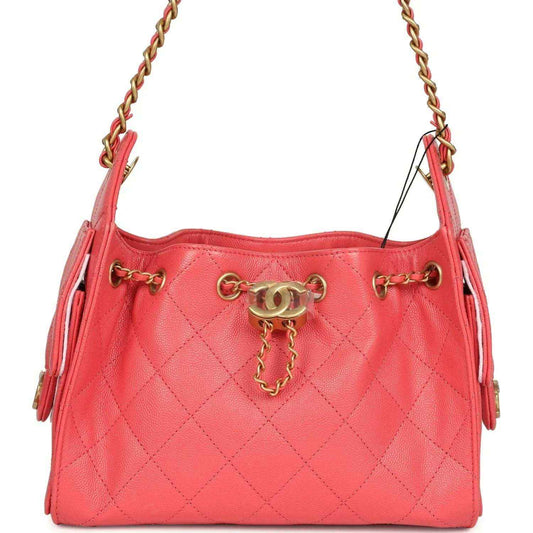 Coral pink quilted mini hobo bag with gold chain handles and front clasp