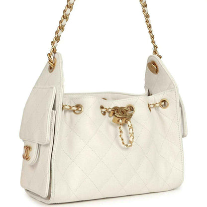 Chanel mini hobo bag in white quilted leather with antique gold chain and front charm detail