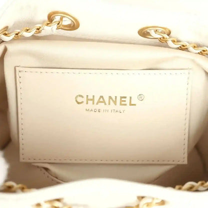 Mini hobo bag interior label reading CHANEL and MADE IN ITALY in gold-tone lettering