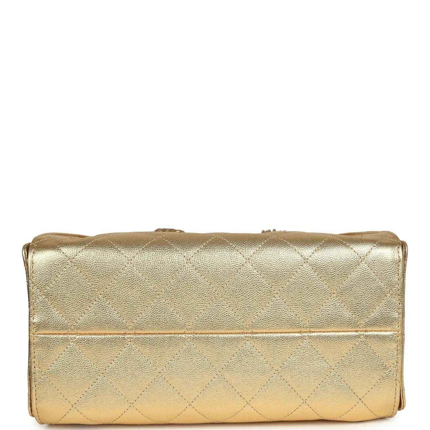 Metallic gold quilted hobo bag bottom with top fold and stitched seam