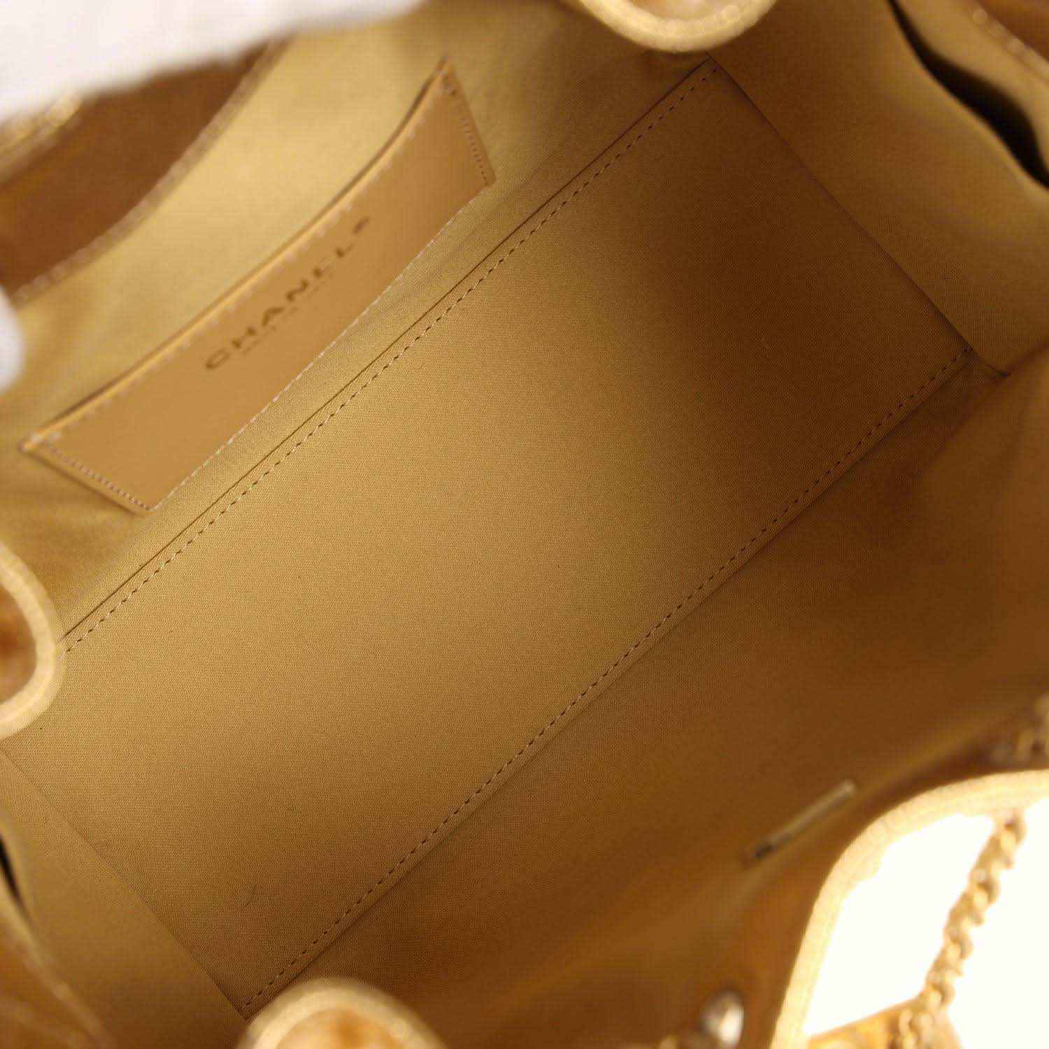 Tan interior lining of hobo bag with stitched panels and slot pocket
