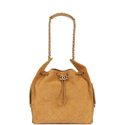 Quilted suede hobo bag with chain handles and CC clasp at center