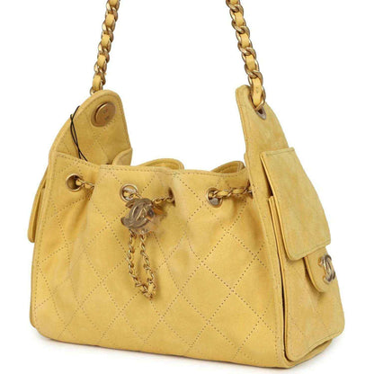 Chanel Mini 25 hobo bag, yellow quilted suede, side flap pocket details, chain strap