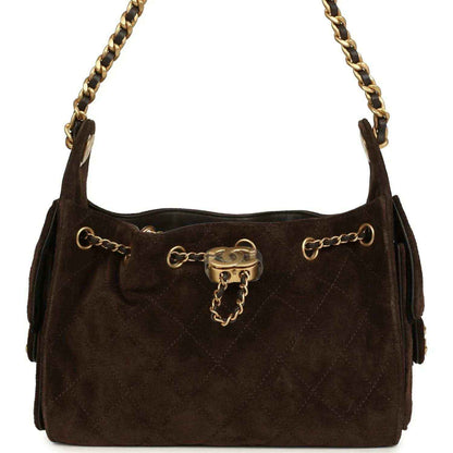 Dark brown suede mini hobo bag with antique gold chain, top clasp, and side rings.