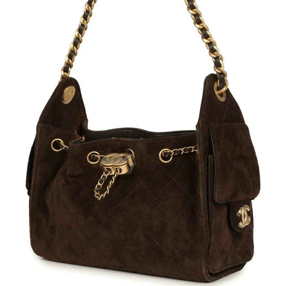 Dark brown suede mini hobo bag with chain shoulder straps and side pocket tab detail.