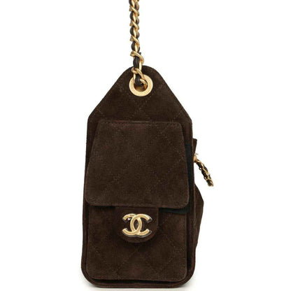 Dark brown suede mini bag charm with top loop and Chanel logo medallion in antique gold.