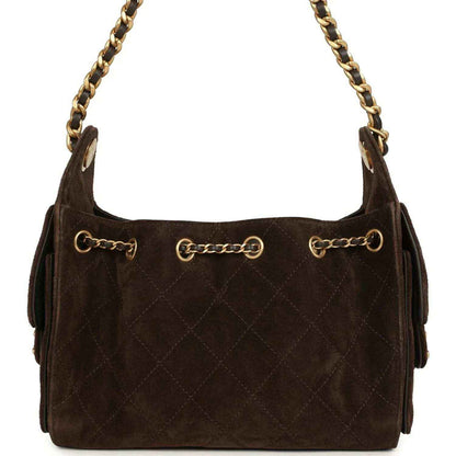 Dark brown suede mini hobo bag with gold-tone chain handles and quilted front paneling.