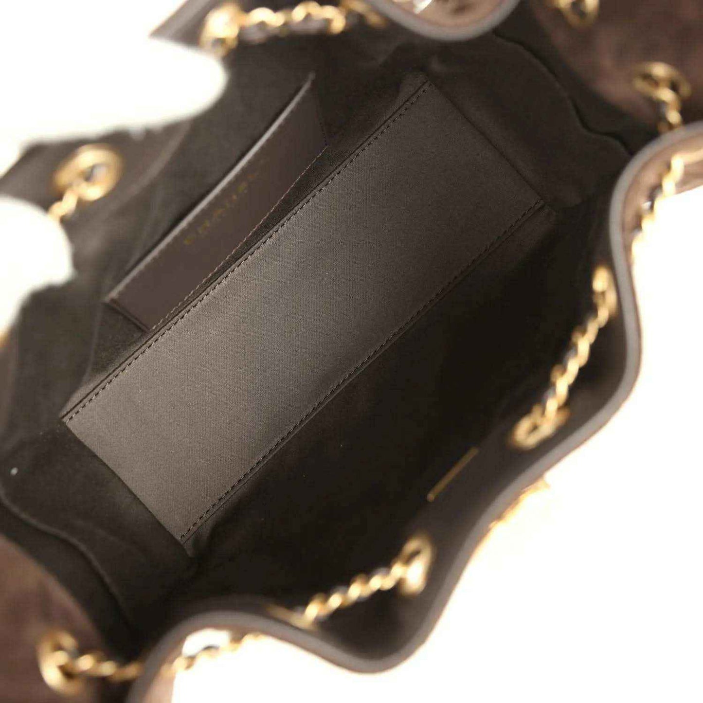 Dark brown suede mini hobo bag interior with stitched pocket panel and gold-tone chain hardware.