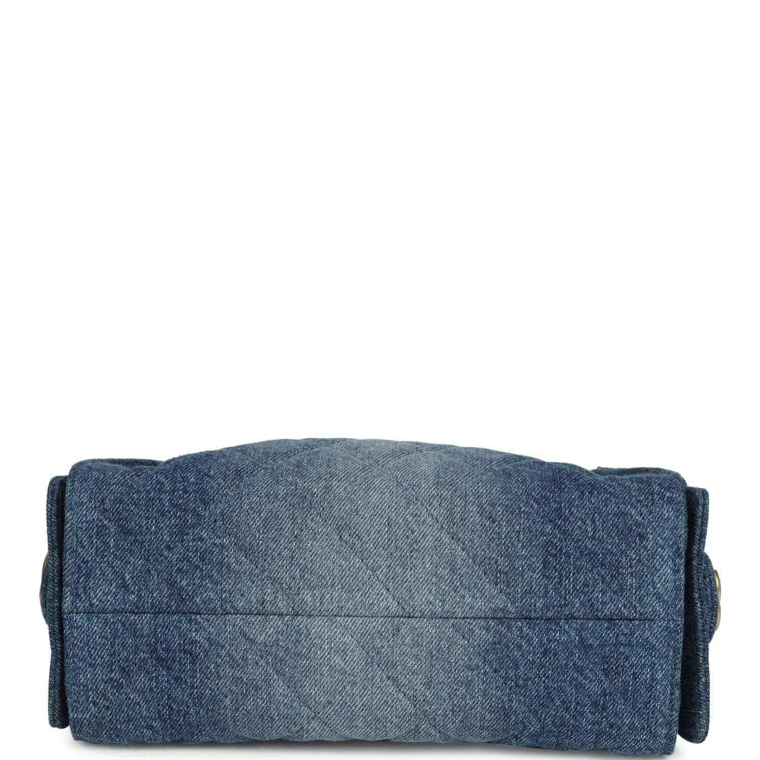 Blue washed denim mini hobo bag back panel with stitched fold and structured base