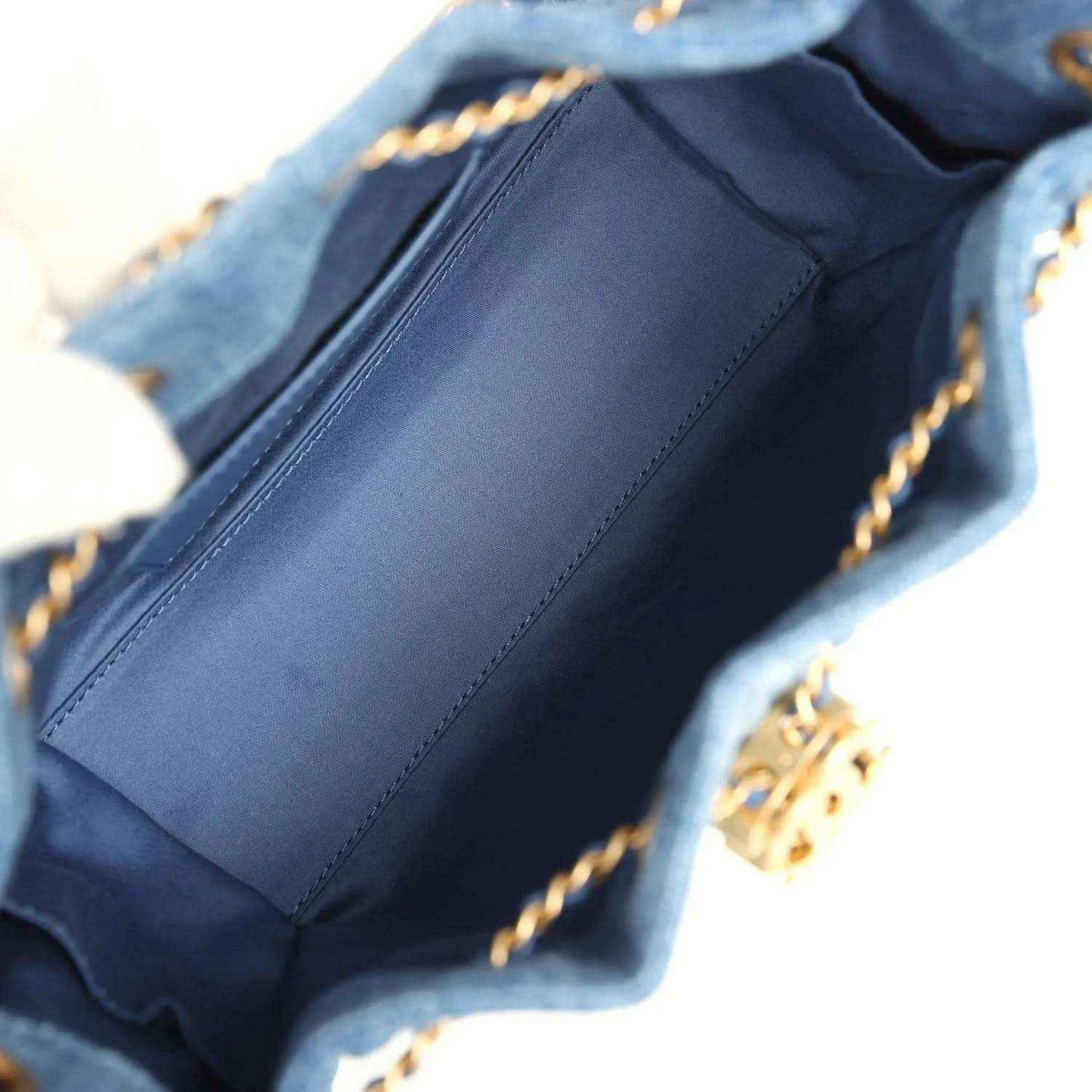 Blue denim mini hobo bag interior lining with stitched seams visible inside