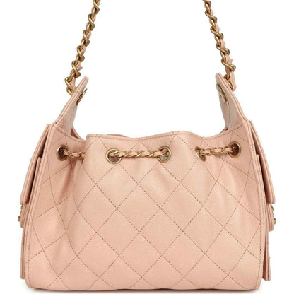 Chanel mini 25 hobo bag with pink quilted front, gold chain handles, and CC clasp