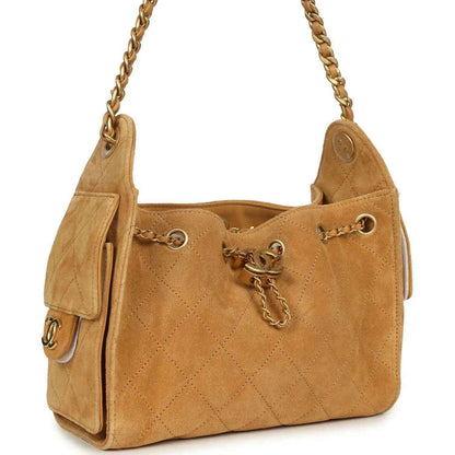 Tan suede hobo bag with quilted diamond stitching, gold-tone chain strap, and CC charm