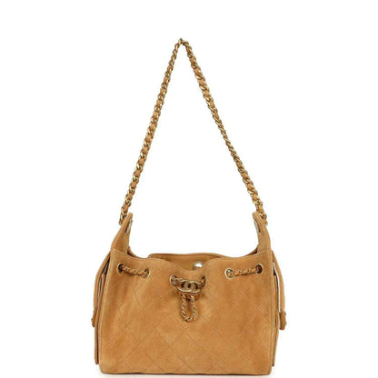 Tan suede mini hobo bag with quilted diamond pattern and gold-tone chain strap