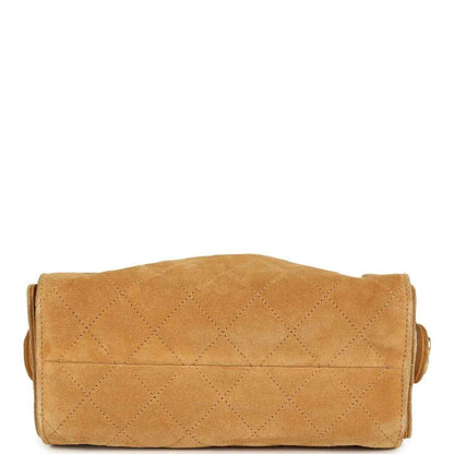 Tan suede hobo bag back panel with quilted diamond stitching and stitched edges