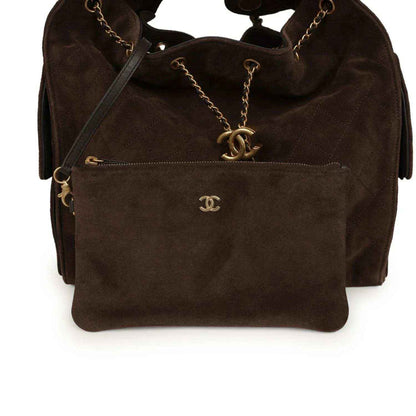 Dark brown suede hobo bag with gold CC logo and front zip pocket